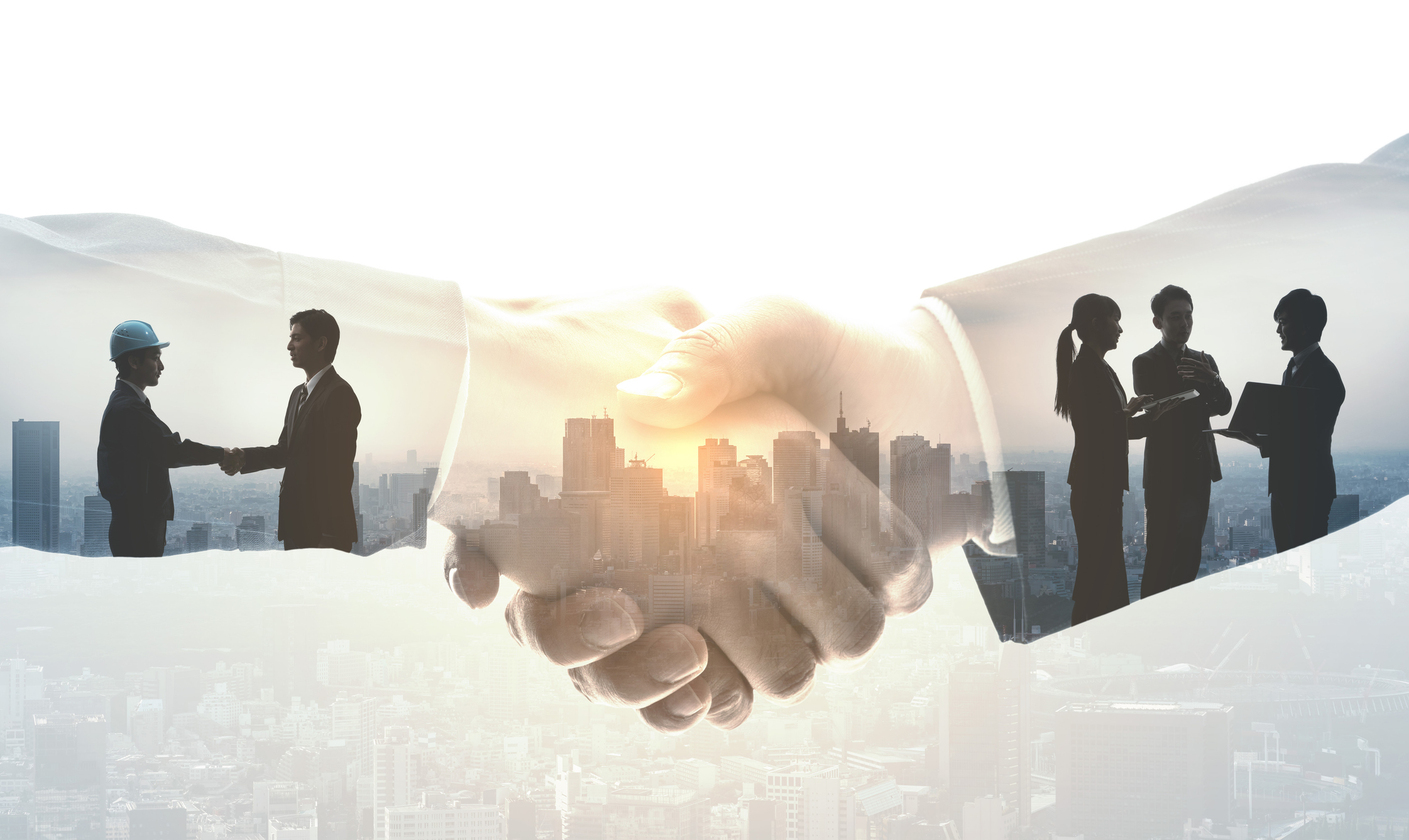 Two businessmen shaking hand & also some consultation from a man about their business.