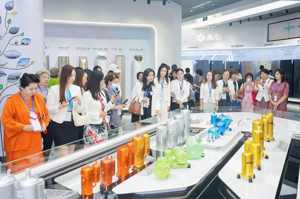 Women visiting an exhibition hall that includes new technology related products