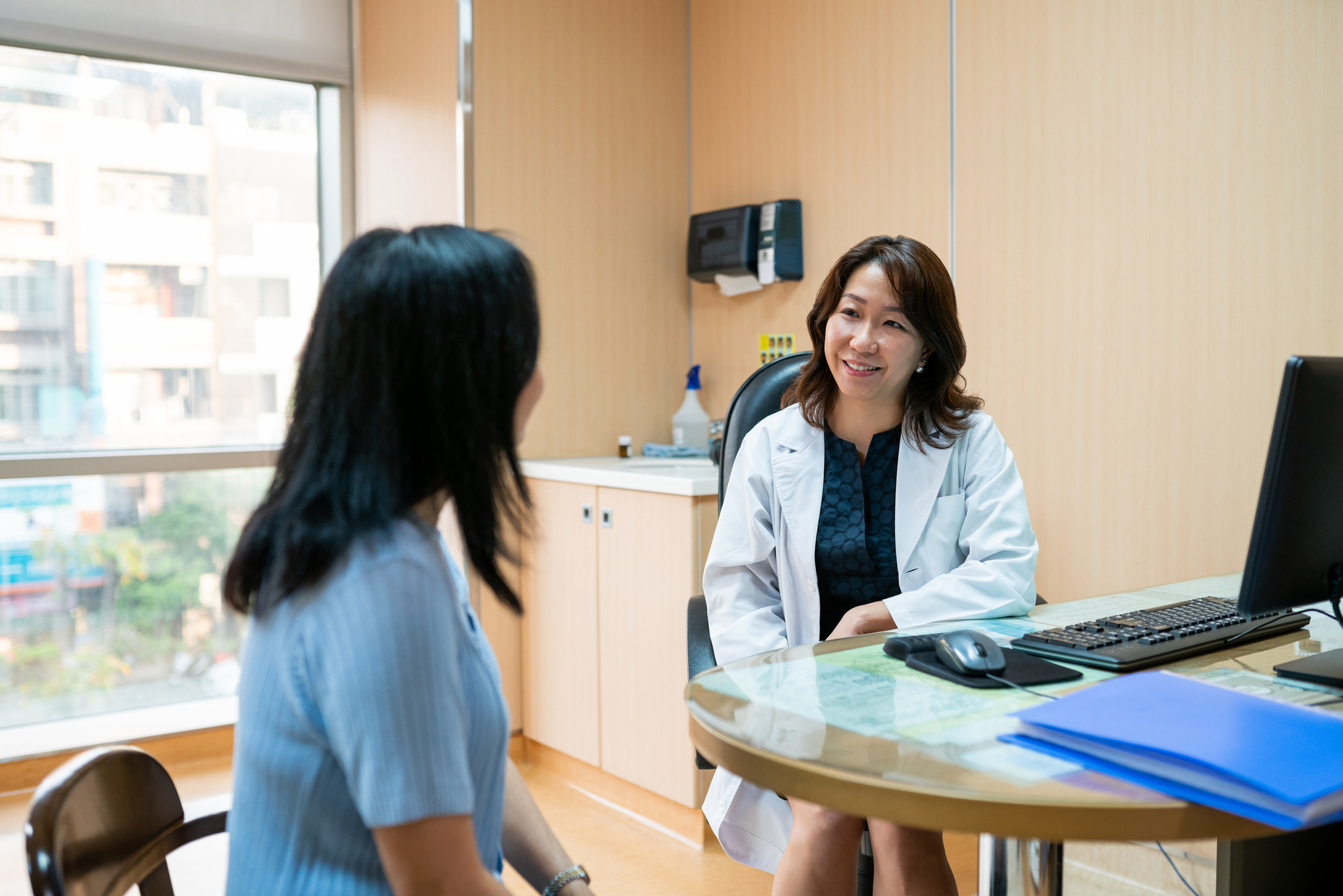 Female doctor talking to a patient in a clinic