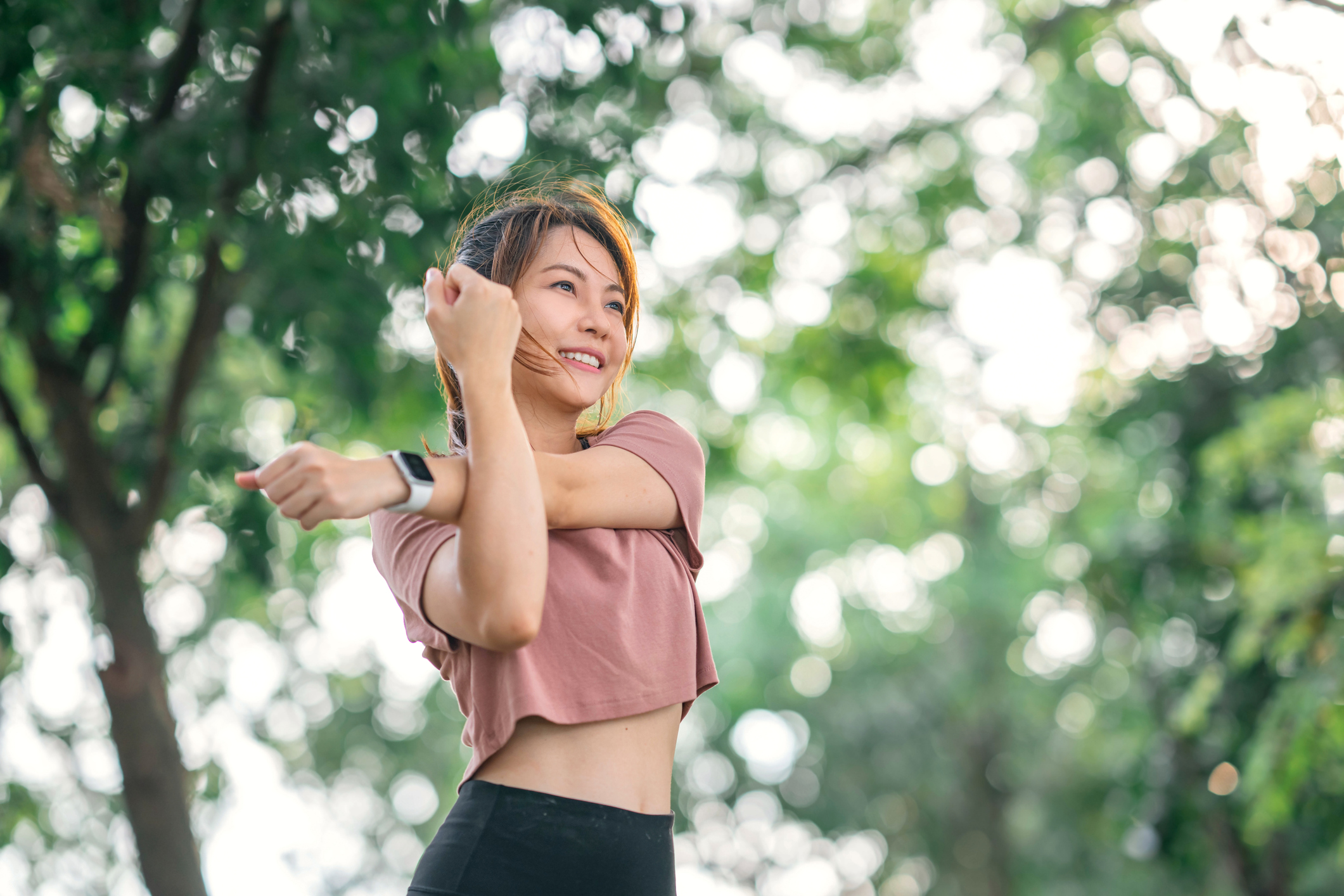 Woman stretching her body outdoor