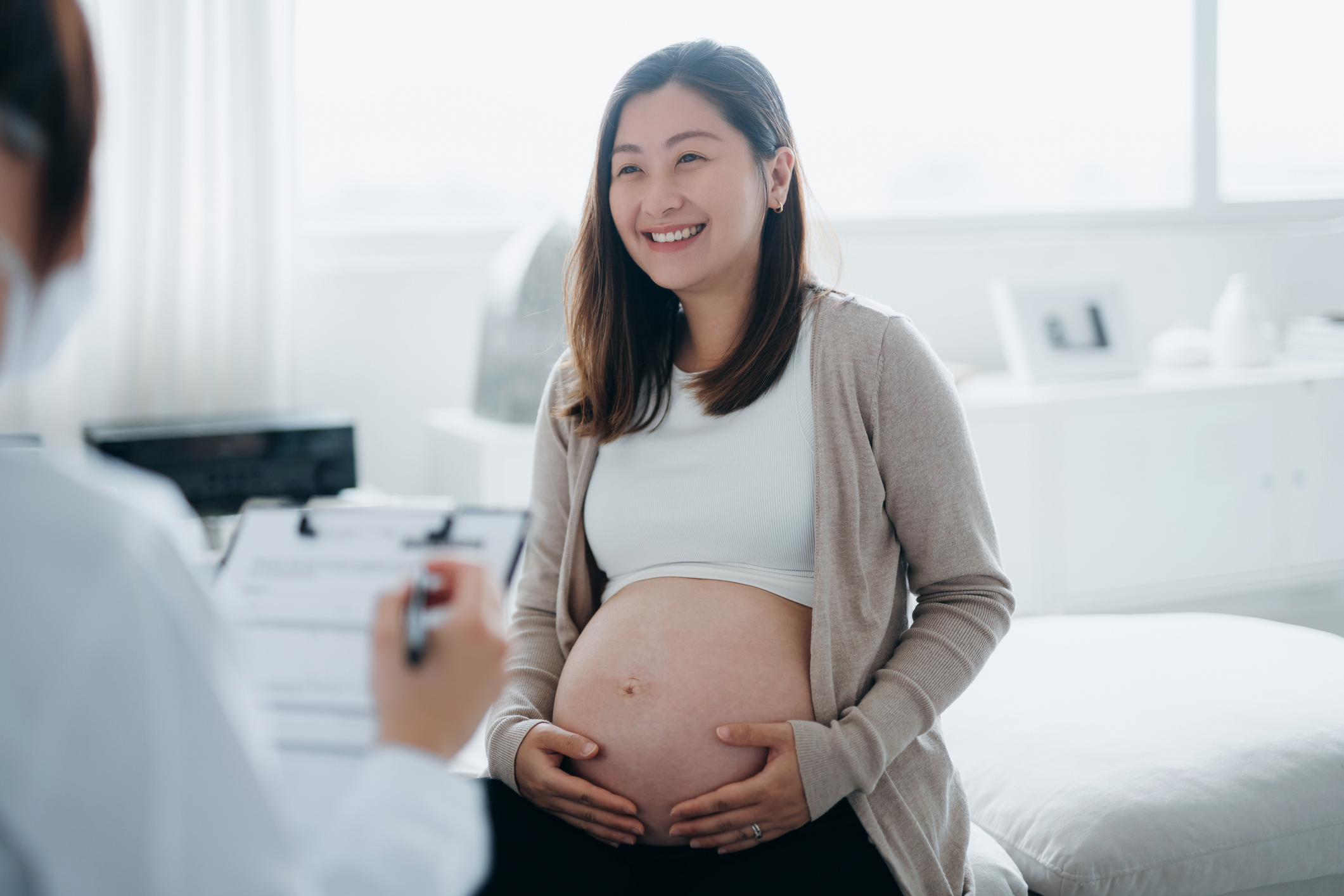 Pregnant woman waiting for health check in a clinic