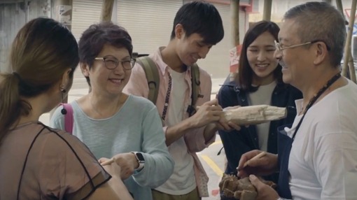 group of people smiling at each other