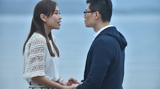 couple chatting by the sea