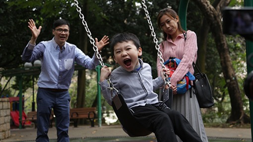 family playing at the park